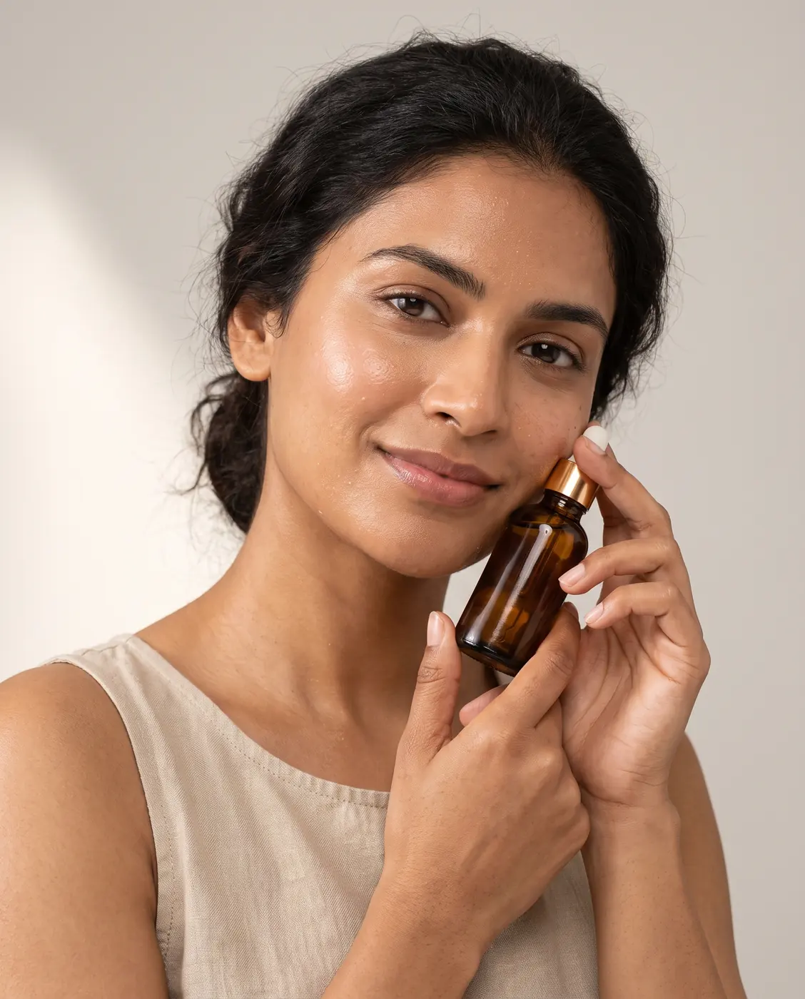 AI-generated model holding an amber serum bottle near her cheek
